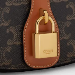 Online CLUTCH ON STRAP TABOU in Triomphe canvas and calfskin Women Triomphe Canvas
