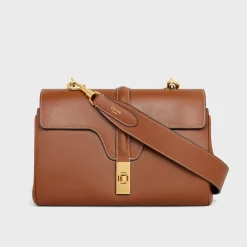 Hot Long Strap in smooth calfskin with GOLD FINISHING Women Categories·Straps And Accessories