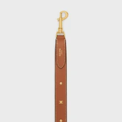 New LONG STRAP in smooth CALFSKIN WITH TRIOMPHE STUDS with Gold Finishing Women Categories·Straps And Accessories