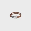 Fashion Triomphe Clasp Bracelet in Calfskin and Brass with Rhodium Finish Bracelets & Rings